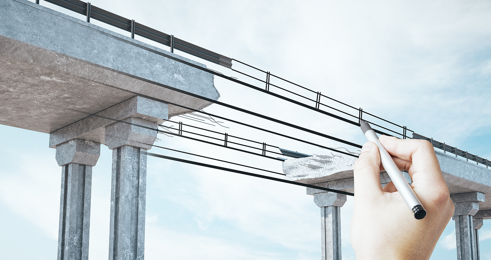Hand zeichnet den Mittelteil einer Brücke
