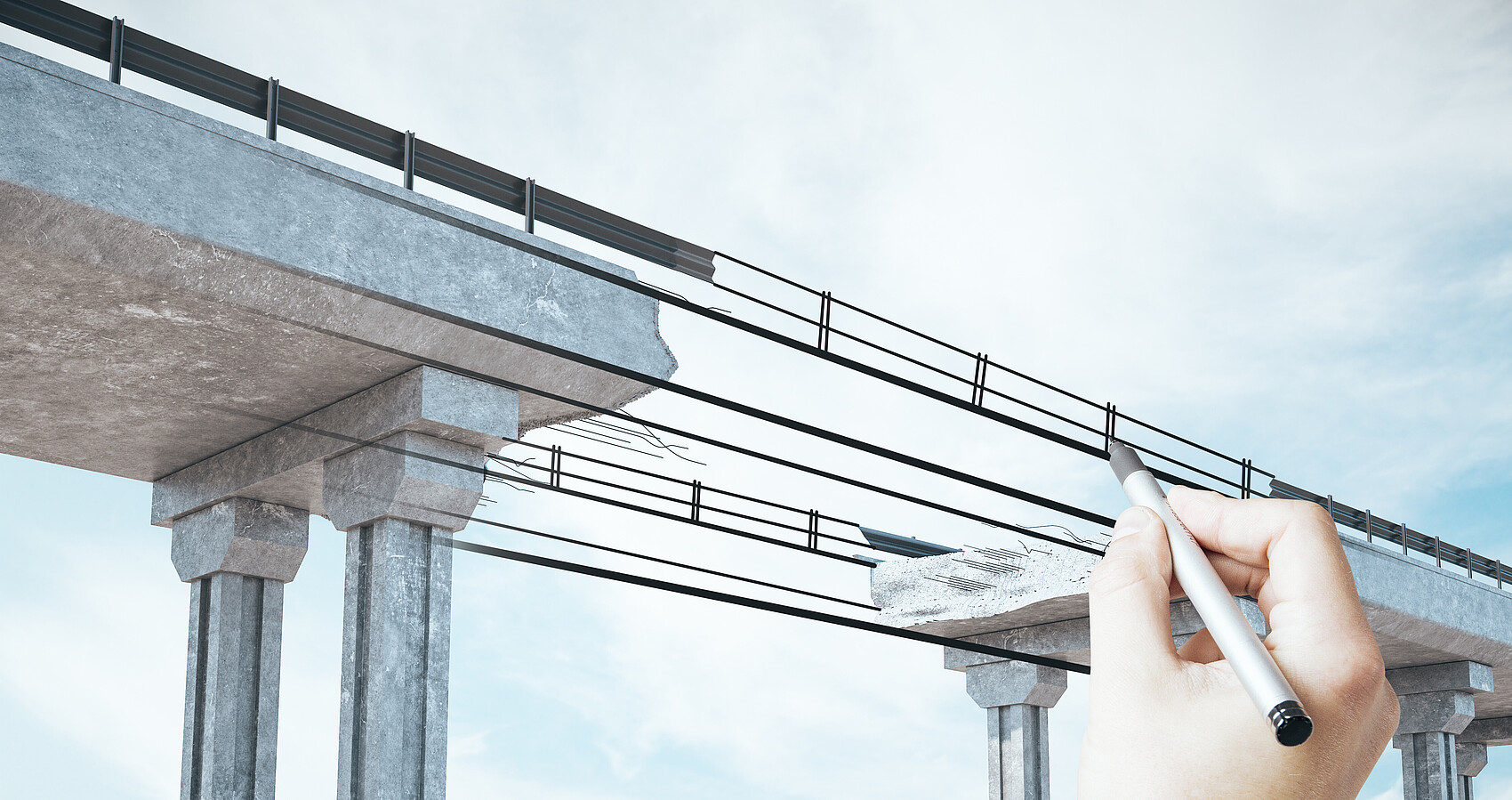 Hand zeichnet den Mittelteil einer Brücke
