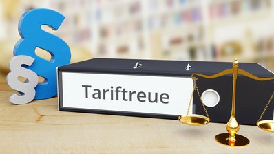 Aktenordner mit Schriftzug Tariftreue und Paragraphenzeichen